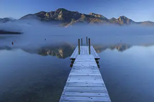 Morning atmosphere at mountain lake in front of mountains