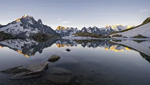 Morning atmosphere at sunrise, water reflection in Lac Blanc