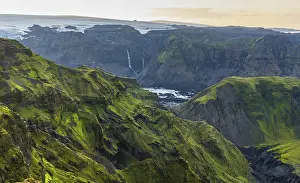 Moss-covered mountains at sunset