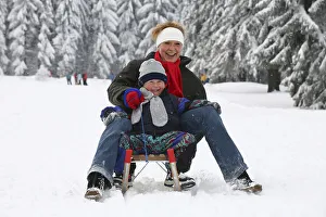 Mother and boy, four years, sledging