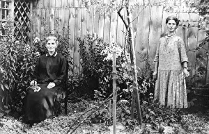 Mother and daughter in a garden