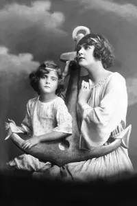 Mother and daughter pose with anchor and hope that the father returns healthy from the sea