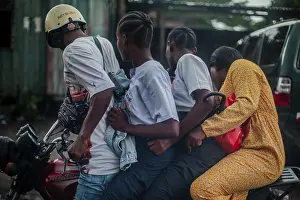 Four on a motorbike, everyday life in Kinshasa