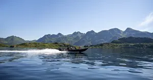 Motorboat with tourists sailing on the Sund Raftsund