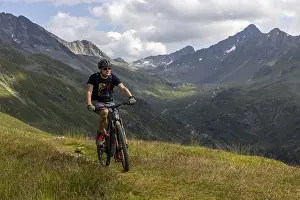 Mountain biker on an alpine bike trail