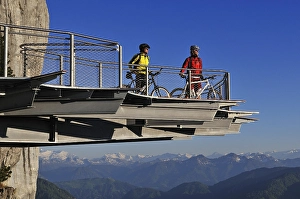 Mountain bikers on a viewing platform in Triassic Park