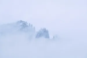 Mountain covered with dence fog, Alps, Germany