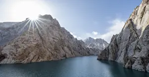 Mountain lake Kol Suu rocky steep mountains
