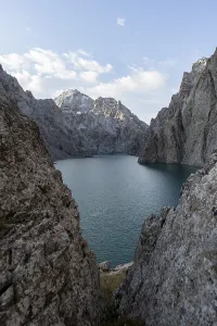 Mountain lake Kol Suu rocky steep mountains