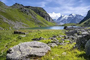 Mountain lake Lac de Louvie with glaciated summit of the Grand Combin