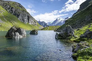 Mountain lake with view of glaciated mountain peaks