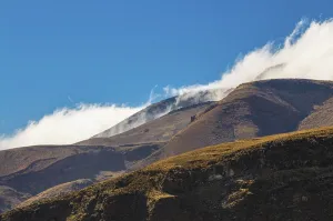 Mountain landscape in dust or with clouds