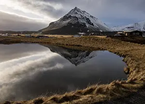 Mountain landscape at and hilltop reflection at a lake