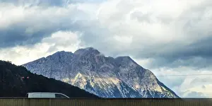 Mountain landscape mountains green fields forest clouds and blue sky in the Alps Vorarlberg Austria