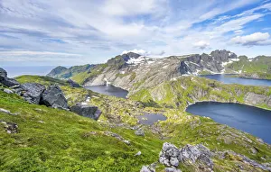 Mountain landscape with steep rocky peaks and lake Tennesvatnet