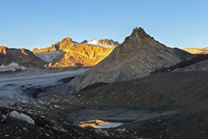 Mountain landscape in sunset lights with glaciers and lake near Elbrus on Caucasus
