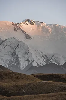 Mountain landscape at sunset, summit of Pik Lenin with glacier