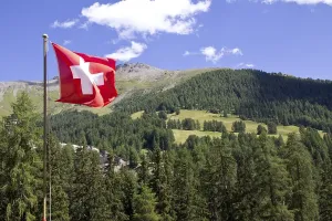 Category Mountain Landscapes Prints: Mountain landscape with a Swiss national flag
