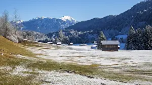 Category Mountain Landscapes Prints: Mountain landscape in winter, in front wooden huts