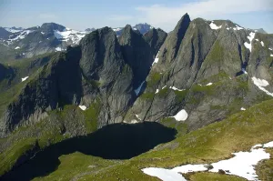 Category Scandinavia Prints: Mountain Munkan with lake and snowfields Moskenesoya Lofoten Norway