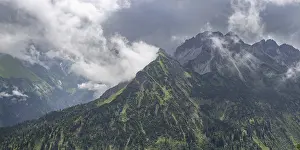 Category Mountain Landscapes Prints: Mountain panorama with many rain clouds from the Fellhorn