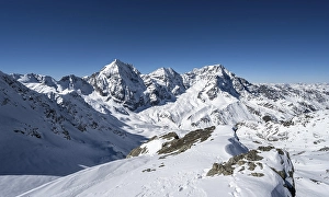Mountain panorama with snow-covered mountain landscape in winter