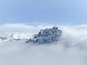 Mountain peak Piz Kesch in the clouds