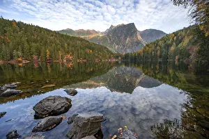 Mountain peaks of the Oetztal Alps reflected in Lake Piburger See