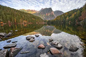 Mountain peaks of the Oetztal Alps reflected in Lake Piburger See