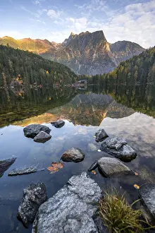 Mountain peaks of the Oetztal Alps reflected in Lake Piburger See