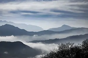 Mountain Range Above Cloudscape in a Sunny Day in Lugano