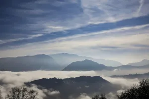 Mountain Range Above Cloudscape in a Sunny Day in Lugano