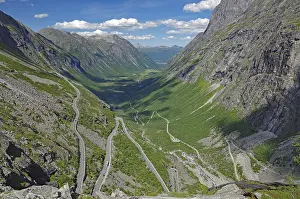Mountain road winds up the mountain in serpentines