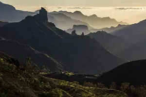 Framed Print : Mountain silhouettes in the back light