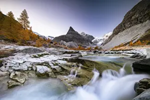 Framed Print : Mountain stream with autumnal larches and mountain views Framed Print : Mountain stream with autumnal larches and mountain views