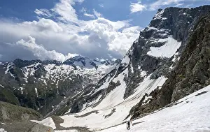 Mountaineer hiking in a snowfield