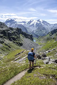 Mountaineer on hiking trail in mountain landscape