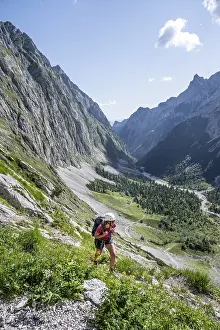 Mountaineer on a hiking trail, mountain landscape in the Hoellental