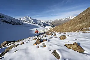 Mountaineer on a hiking trail with snow