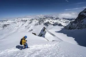 Mountaineer with ice axe and crampons