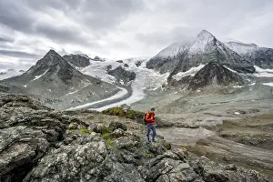 Mountaineer in front of impressive mountain landscape