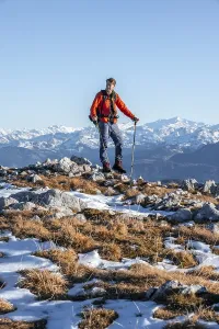 Mountaineer in front of mountain panorama