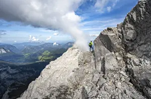 Mountaineer on a narrow rocky ridge