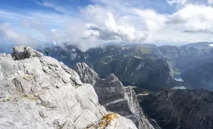 Mountaineer on the rocky summit of the Watzmann Mittelspitze