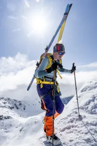 Mountaineer with skis at the fork Porta d'Es-cha