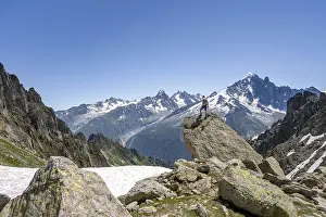 Mountaineer standing on a rock