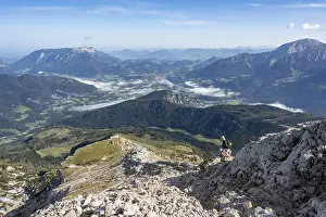 Mountaineer on steep hiking trail to Watzmann Hocheck summit