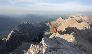 Mountaineer on a steep rocky ridge