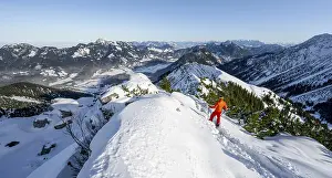 Mountaineer on the summit of the Aiplspitz in the snow