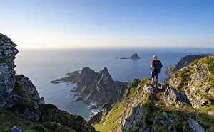 Mountaineer on the summit of Matind or Matinden